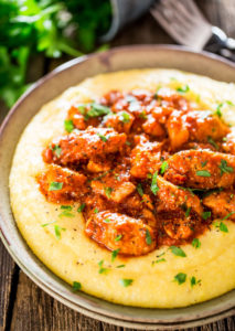 Saucy Chicken & Sausage Over Creamy Parmesan Polenta by Jo Cooks