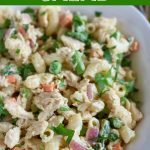 close up overhead angled shot of finished tuna pasta salad in a white bowl