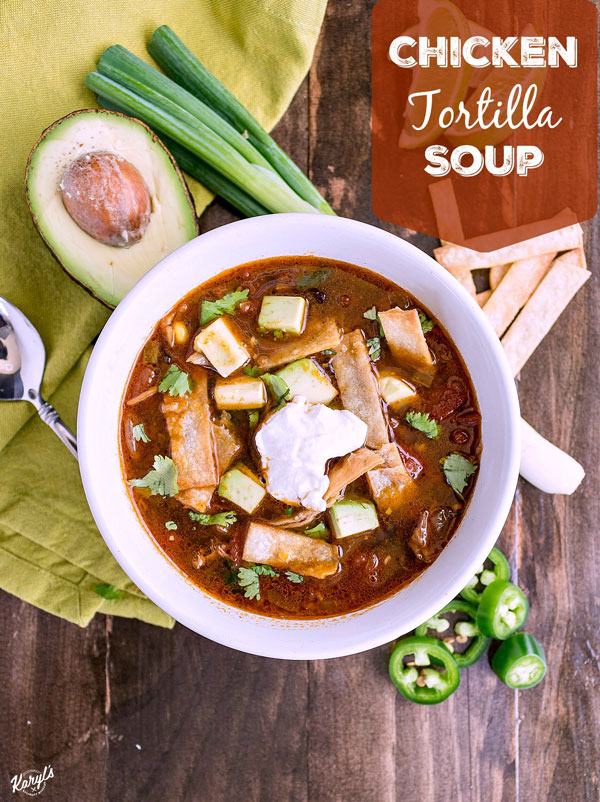 Chicken Tortilla Soup will warm you up with tender chicken, lots of veggies, and a bold kick from the spices. Finish with homemade tortilla strips, diced avocado, a little sour cream and sharp cheese. Ready in under 30 minutes on the stove, or in the crock pot after a long day #chicken #corn #blackbeans #jalapeno #tortillastrips #chickentortillasoup #spicysoup #easyrecipe #comfortfood #karylskulinarykrusade Chicken Tortilla Soup will warm you up with tender chicken, lots of veggies, and a bold kick from the spices. Finish with homemade tortilla strips, diced avocado, a little sour cream and sharp cheese. Ready in under 30 minutes on the stove, or in the crock pot after a long day #chicken #corn #blackbeans #jalapeno #tortillastrips #chickentortillasoup #spicysoup #easyrecipe #comfortfood #karylskulinarykrusade