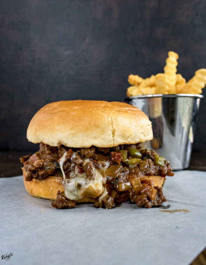 Venison Cheesesteak Sloppy Joes. A fabulously flavorful combination of burger and cheesesteak. And did I mention bacon?! Enjoy these as sandwiches, sliders, or even just in a bowl. Just dive in, and make sure you have napkins handy! #venison #gamemeat #deermeat #cheese #cheesesteak #bacon #sandwich #sloppyjoe #venisoncheesesteaksloppyjoe #karylskulinarykrusade