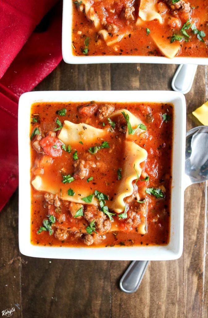overhead shot of 2 white bowls filled with venison lasagna soup