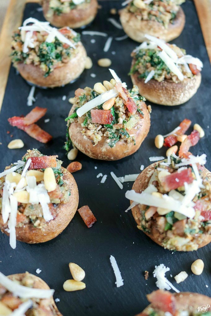 Spinach and Bacon Stuffed Mushrooms are a perfect party appetizer. Fill plump white mushroom caps with the easy, make-ahead filling, and they're fresh out of the oven in about 20 minutes #appetizer #easyappetizer #gamedayfood #tailgatefood #bitesized #mushrooms #stuffedmushrooms #spinach #bacon #pinenuts #karylskulinarykrusade Spinach and Bacon Stuffed Mushrooms are a perfect party appetizer. Fill plump white mushroom caps with the easy, make-ahead filling, and they're fresh out of the oven in about 20 minutes #appetizer #easyappetizer #gamedayfood #tailgatefood #bitesized #mushrooms #stuffedmushrooms #spinach #bacon #pinenuts #karylskulinarykrusade