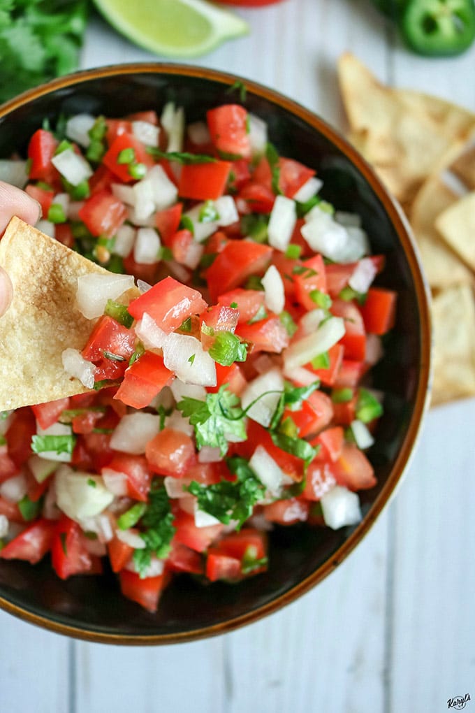 overhead shot of Pico de Gallo, with a closeup of a little bit on a chip
