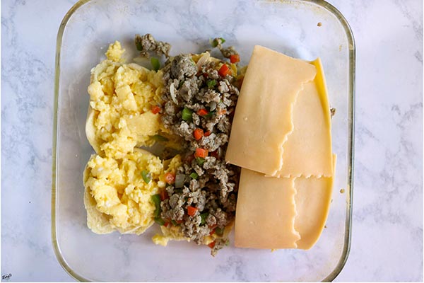 overhead process shot: layering sliders in a baking dish 