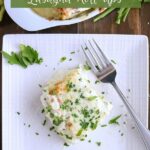 overhead shot of finished spinach alfredo lasagna roll ups on a white plate