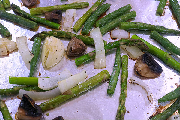 Process shot: close up shot of roasted vegetables on a baking sheet