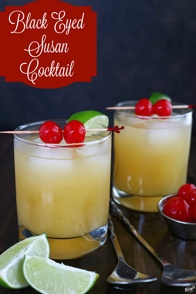 2 glasses of Black Eyed Susan, with lime wedges in front, stirring spoon and maraschino cherries on the side close up shot of 2 Black Eyed Susan cocktails with lime and cherries on the side