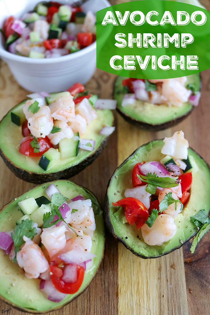 close up shot of 4 finished stuffed avocados with a bowl of ceviche in the background