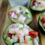 close up shot of 2 finished shrimp ceviche in avocados