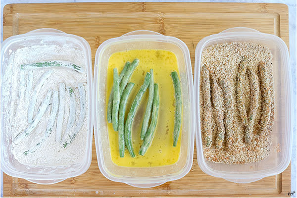 overhead process shot: green beans in each stage of breading
