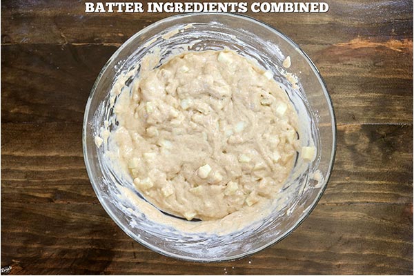 Overhead process shot: all batter ingredients combined in a glass bowl